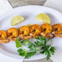 Shrimp Kabob · Seasoned shrimp served with grilled vegetables and cocktail sauce.