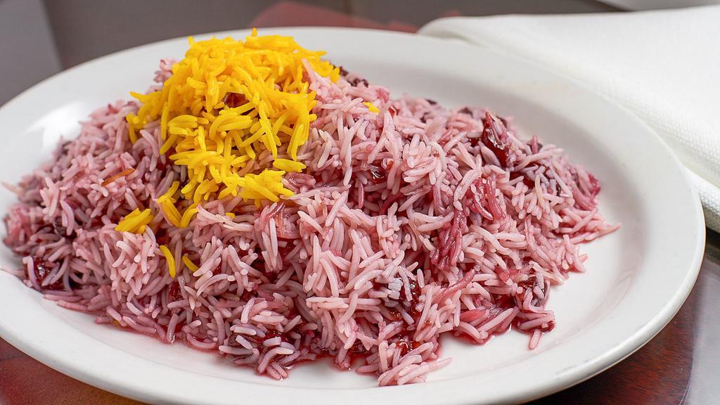 Zereshk Polo · Basmati rice mixed with red sweet and sour barberries.