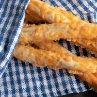 Cheese Breadsticks · Cheese blend melted over breadsticks. Served with marinara sauce.