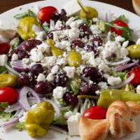 Greek Salad · Ripe tomatoes, cucumbers, red onions, kalamata olives, feta and pepperoncini over garden sal...