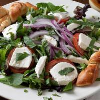 Caprese Salad · Spring mix, red onion, sliced tomato, fresh mozzarella cheese garlic knots, fresh basil on t...