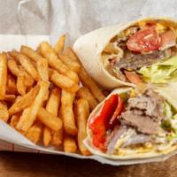 The Philly Cheesesteak Wrap · Delicious hot marinated steak cooked with peppers and onions all wrapped up in a flour torti...
