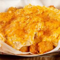Crabby Tots · Crispy tater tots topped with homemade crab dip, melted cheeses, old bay.