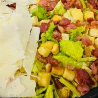 Caesar Salad · Crunchy Romaine lettuce, oven-cooked bacon, Parmesan cheese and Croutons, dressed with Caesa...