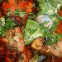 Chicken Tandoori  · Chicken on the bone marinated in yogurt, ginger & freshly ground spices. Skewered & grilled ...