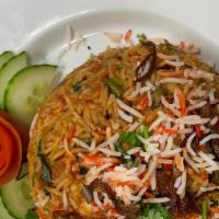 Chicken Biryani  · Basmati rice, cooked with marinated chicken, nuts, dried fruits, vegetables with a blend of ...
