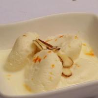 Rasmalai · Cheese and flour dumplings served with creamy milk syrup.