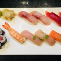 Sushi Deluxe · Raw. Nine pieces sushi with a tuna roll.

Consuming raw or undercooked meat, poultry, seafoo...
