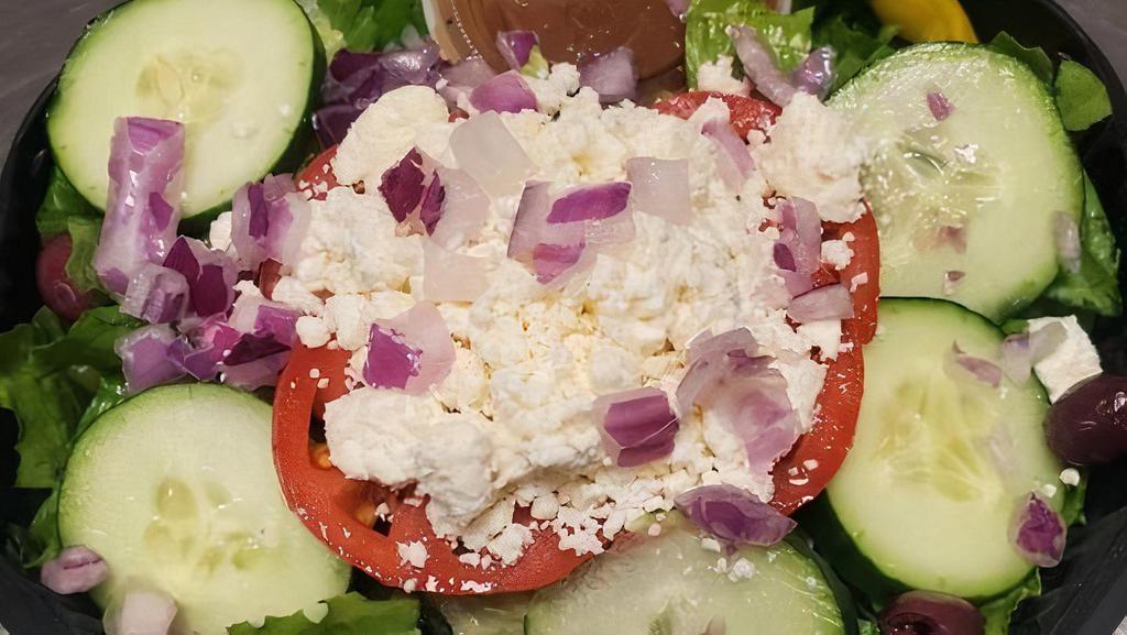 Greek Salad · Romaine, feta, red onion, olives, pepperoncini, tomato and cucumber.