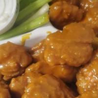 Double Boneless · Breaded and crispy fried boneless wings. Served with your choice of blue cheese or ranch dre...