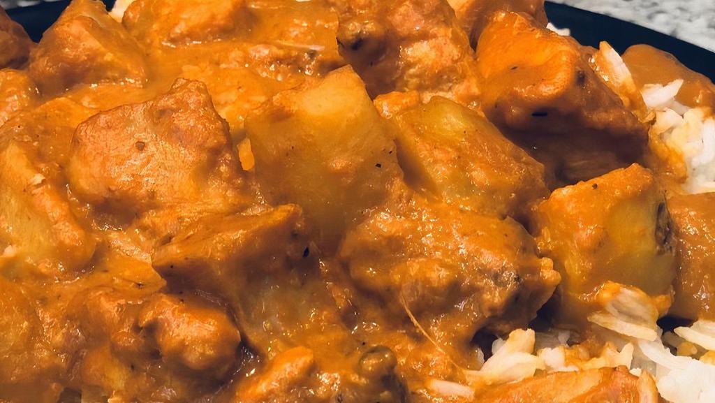 Chicken Curry · Tender chicken pieces cooked in garlic, ginger, onions, tomatoes and Indian spices.