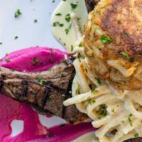 Pasta Bay E Monte · 3 Char-grilled Lamb Chops, 8 oz. jumbo lump crab cake, Old Bay alfredo, pappardelle (wide fl...