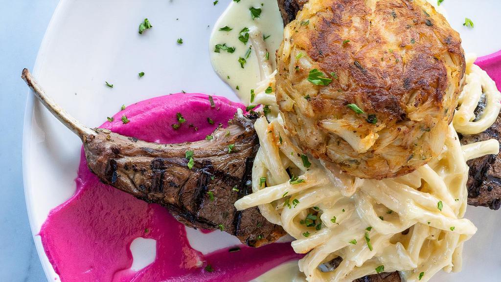 Pasta Bay E Monte · 3 Char-grilled Lamb Chops, 8 oz. jumbo lump crab cake, Old Bay alfredo, pappardelle (wide flat noodle).