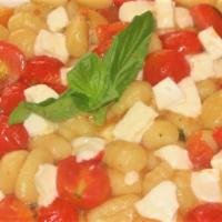 Caprese Gnocchi · White wine garlic sauce, tomatoes, fresh mozzarella and basil.