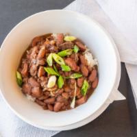 Red Beans & Rice · Slow cooked red beans, smoked sausage, smoked turkey, onions, garlic, green peppers, garlic,...
