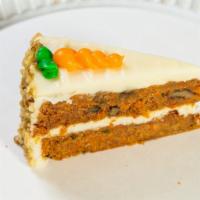 Carrot Cake · Moist spice cake with raisins, walnuts and shredded organic carrots topped with a cream chee...