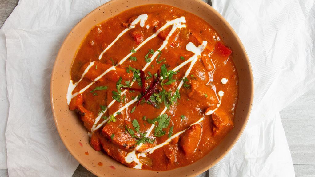 Chicken Tikka Masala · A typical north Indian homestyle preparation, simmered in onion and creamy tomato sauce.