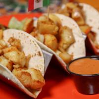 Fish Tacos · Three corn or flour tortillas filled with grilled or fried tilapia, pico de gallo and accomp...