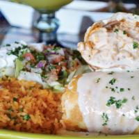 Chimichanga · Fried flour tortilla filled with your choice of beef tips or chicken. Topped with our homema...