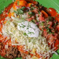 Enchiladas Supreme · Combination of corn tortilla enchiladas; one chicken, one beef, one cheese and one bean, top...