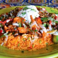 Arroz Con Pollo · Marinated chicken strips grilled with sautéed onions, bell peppers, mushrooms, and tomatoes....
