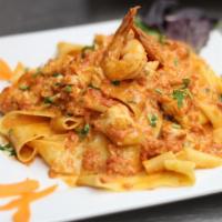 The Godfather · Shrimp and colossal crab meat sauteed in extra virgin olive oil and marinara cream sauce, to...