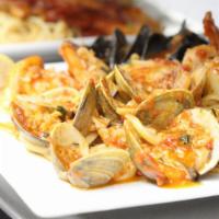 Linguini Pescatore · Fresh shrimp, scallops, clams and mussels served over linguini in our homemade zesty tomato ...