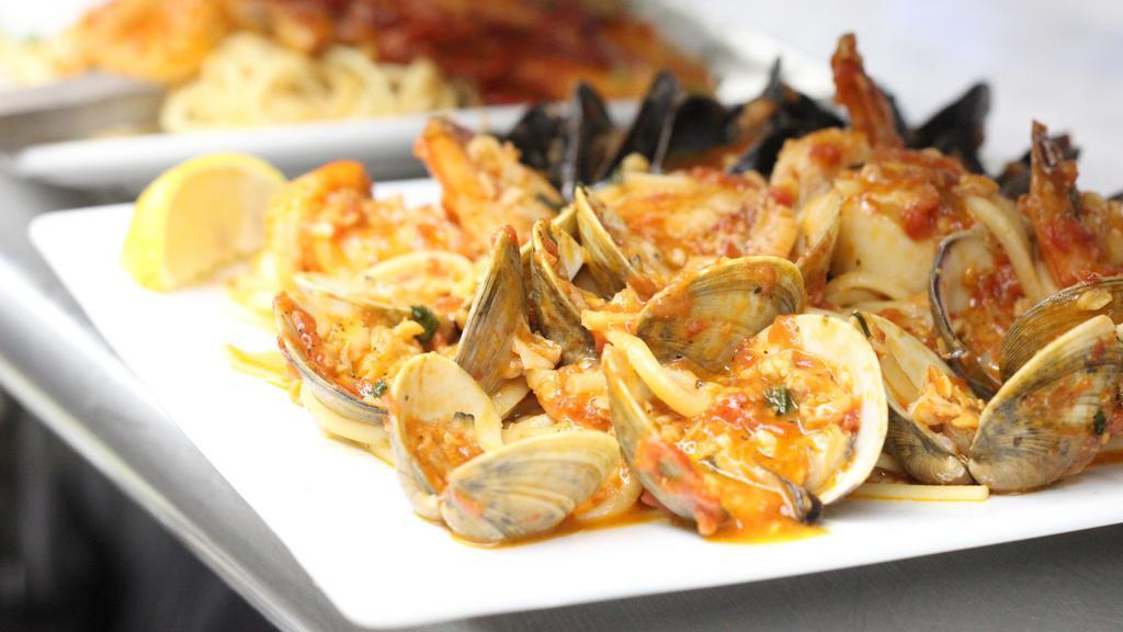 Linguini Pescatore · Fresh shrimp, scallops, clams and mussels served over linguini in our homemade zesty tomato sauce.