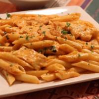 Penne Vodka · Bacon sauteed and splashed with vodka, simmered in a pink sauce with a touch of parmesan che...