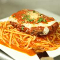 Chicken Parmesan · Breaded chicken breast baked with tomato sauce, topped with fresh mozzarella. Served over sp...