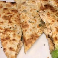 Quesadilla - Chicken · Diced grilled chicken folded into a flour tortilla with pico de gallo and blended cheeses. S...