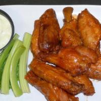 Wings · Crispy wings tossed in one of our housemade sauces. Served with celery, carrots and bleu che...