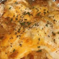 Crab Dip Tot Skillet · Crispy tots, topped with our crab dip, melted shredded cheese and old bay. Served with spicy...