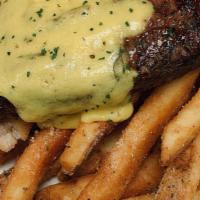 Steak Frites · 12oz ribeye, grilled to your liking and topped with herb butter, served with truffle french ...