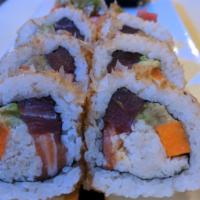 The Robo Roll · Inside out roll (sushi rice on the outside). Salmon, yellowfin ahi tuna, crab, avocado, carr...