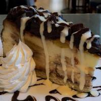 Chocolate Top Cheesecake · Classic cheesecake with a graham cracker crust & Berger cookie throughout. Topped with a cho...