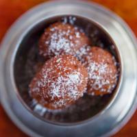 Gulab Jamun · Cottage cheese balls deep-fried and dipped in sugar syrup.