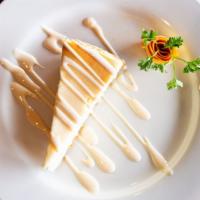 New York Cheesecake · A creamy rich NY cheesecake with graham cracker crust