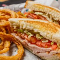 Turkey Club · Freshly made with cheese, bacon, lettuce, tomato, and mayonnaise, layered between toasted br...