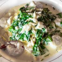 Seafood Florentina · A combination of jumbo shrimp scallops and lump crab meat sautéed in an alfredo sauce. Serve...