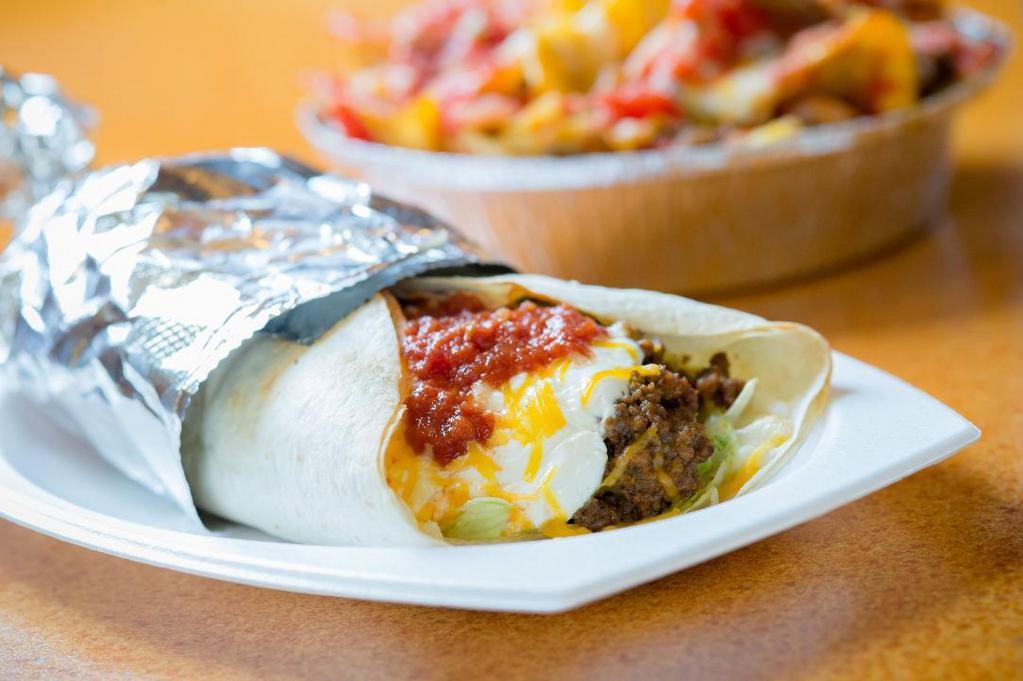 Burrito Supremo · Our traditional burrito filled with your choice of beef, refried beans or a combination of the two, lettuce, cheeses, sour cream and homemade mild sauce.