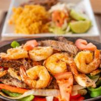 Fajitas Texanas · A combination of grilled shrimp, chicken and steak with sauteed vegetables.
