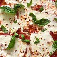 Margherita Pizza · Fresh basil, rich tomato sauce & fresh mozzarella cheese.