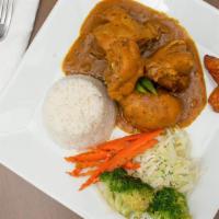 Curry Chicken · Marinated and simmered in authentic curry spices and sauce.