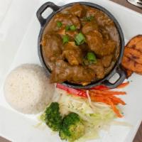 Curry Goat · Bone-in goat meat in curry spices.