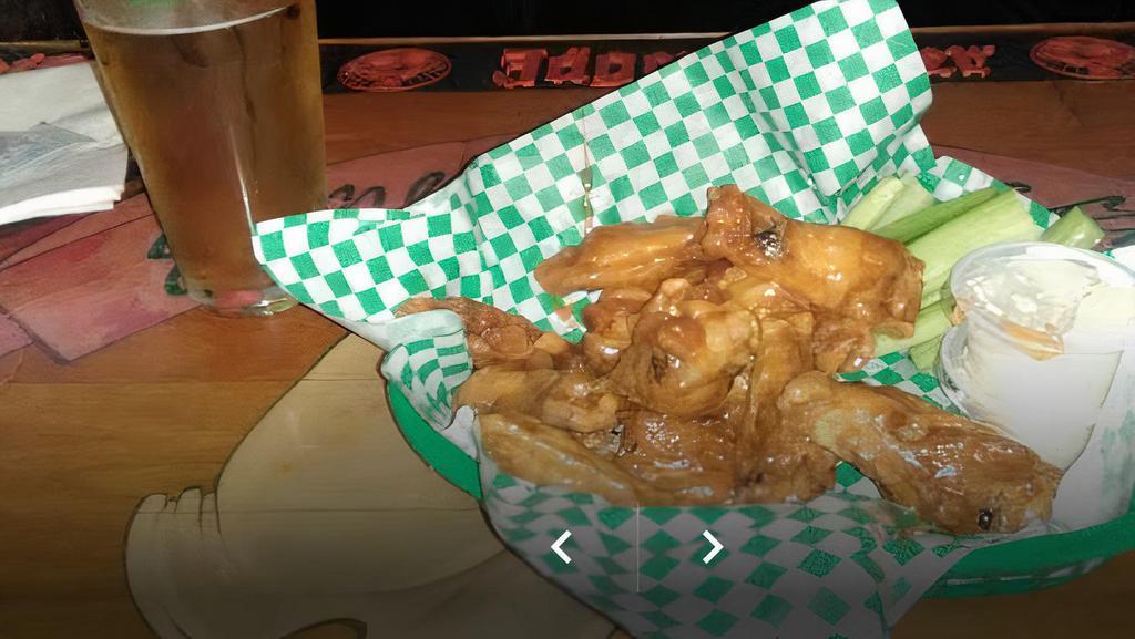 Chicken Wings · 10 jumbo wings bone-in or boneless deep fried, served with ranch or blue cheese and celery.