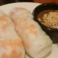 Crispy Spring Rolls On Vermicelli · Served over soft vermicelli, fresh bean sprouts lettuce and basil in an individual bowl, top...