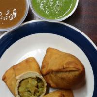 Samosa · Vegan. Traditional Indian deep fried pastries stuffed with potatoes, peas and light spices. ...