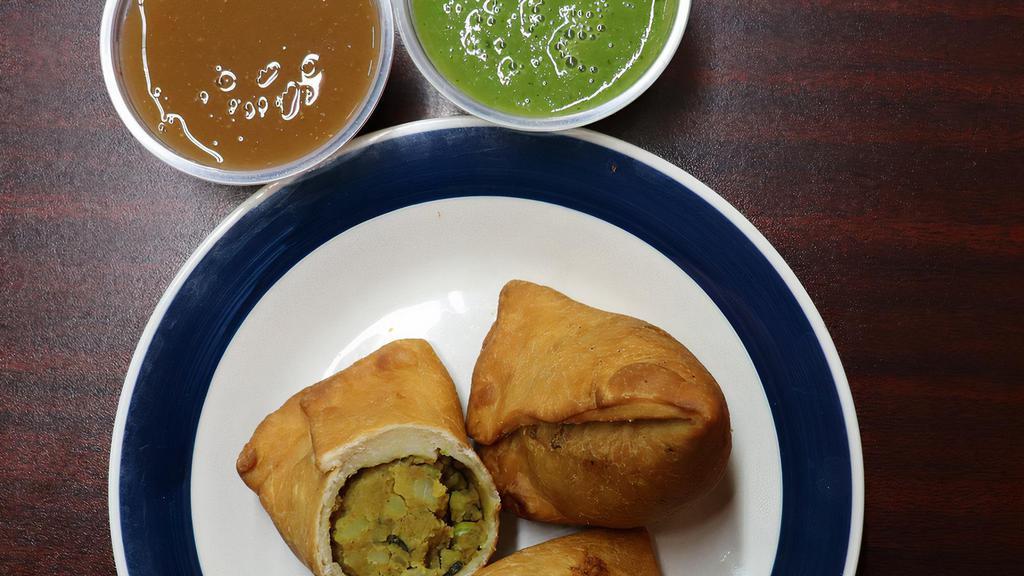 Samosa · Vegan. Traditional Indian deep fried pastries stuffed with potatoes, peas and light spices. Served with chutney. Two per order.