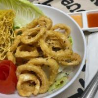 Happy Calamari · Golden fried calamari rings served with a spicy mayo dipping sauce